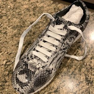 Black and sliver sneakers very clean. Only wore once